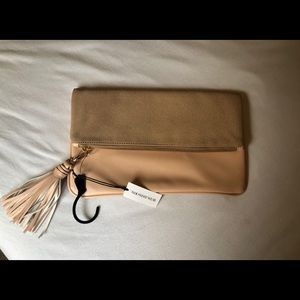 WhoWhatWear peach and taupe clutch with tassel
